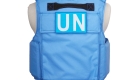 Back side of H Win's blue bulletproof vest featuring Level IV ceramic insert plates